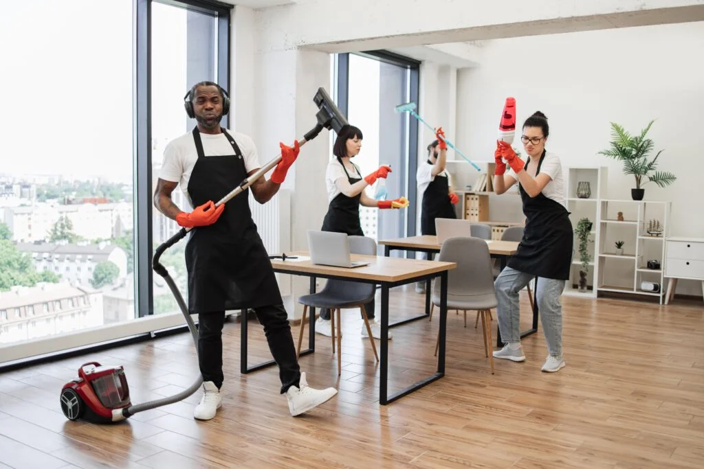 Cleaning team working in a bright office