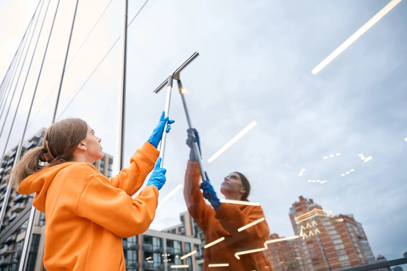 Professional cleaning a commercial window